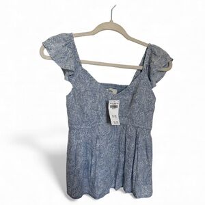 Hollister Light Blue Floral baby doll
Blouse, backyard BBQ. Size medium NWT